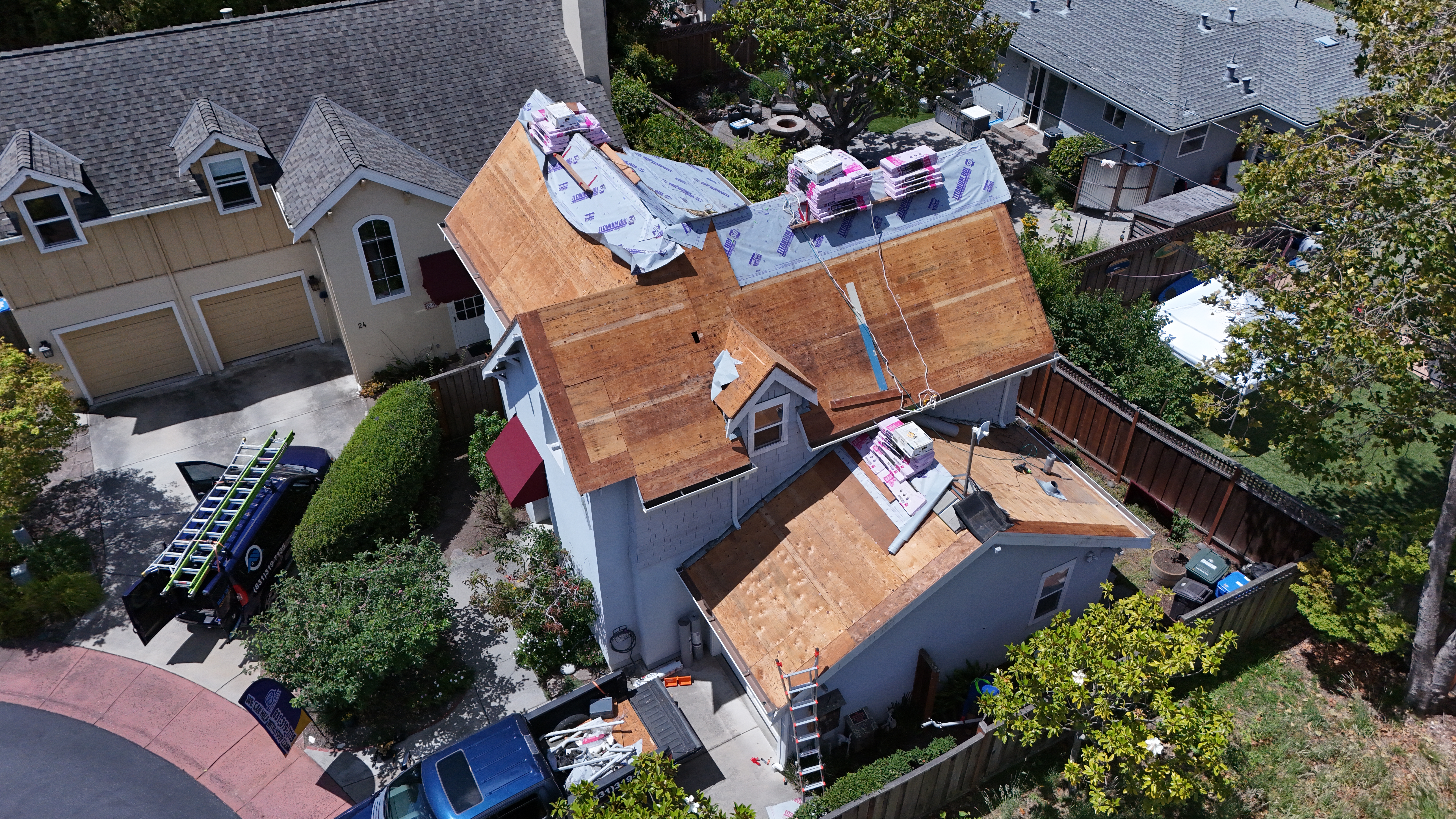 Blue Sky Roofing crew and truck on site – full roof tear-off underway